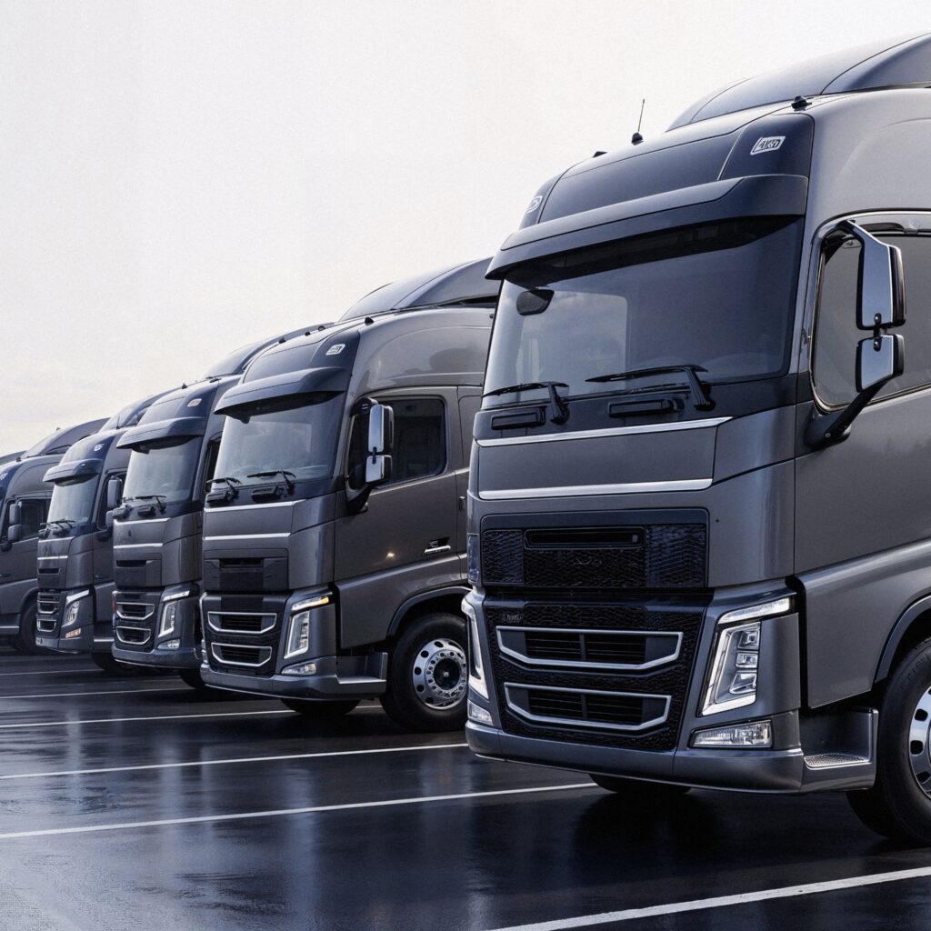 row modern semi trucks parking lot